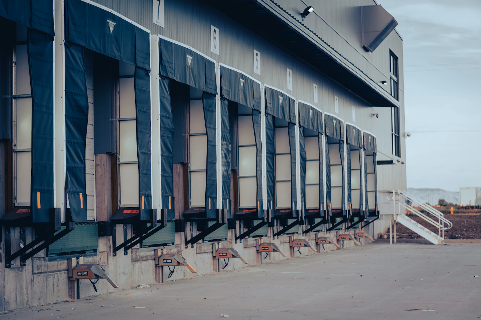 Row of warehouse loading docks with dock seals