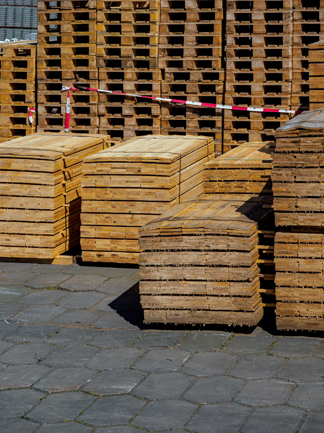 Wrapped pallets and skids staged for loading